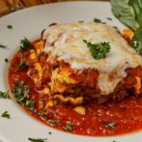Neapolitan Lasagna · Three cheese and meat lasagna with mamas marinara sauce. Comes with garlic bread and your ch...