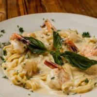 Fettuccine Alfredo With Shrimp · Fettuccine pasta tossed in our homemade alfredo sauce topped off with grilled shrimp. Comes ...