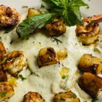 Ravioli Santa Barbara With Grilled Shrimp & Scallops · Ravioli pasta stuffed with ricotta cheese tossed in our creamy Alfredo sauce topped with gri...
