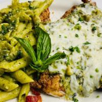 Chicken Santa Barbara · Lightly breaded chicken topped off with creamy spinach, bacon mozzarella served with penne p...