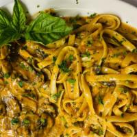 Veal Marsala · Veal cutlets pan sautéed in marsala wine mushroom cream sauce served with pasta. Comes with ...