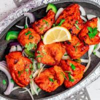Chicken Tikka Tandoor · Traditionally seasoned with spices and yogurt, cooked in a clay oven.