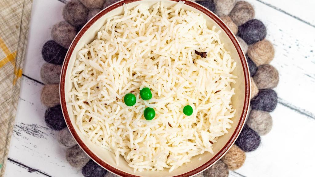 Basmati Rice · Long grain basmati rice; seasoned with cumin, bay leaf, and other aromatic spices.
