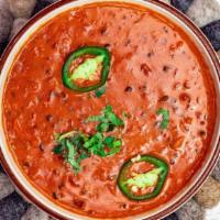 Daal Makhani · Slow-cooked mixed dark lentils with onions, tomato, and cilantro in a creamy sauce..... come...