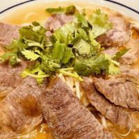 Mulan Beef Soup Noodles · Beef broth, fresh noodle, sliced beef, green onion, cilantro.