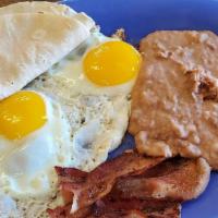 Especial Del Dia / Daily Special · Dos huevos con tocino, chorizo o jamón. / Two eggs to your taste with bacon, chorizo or ham.