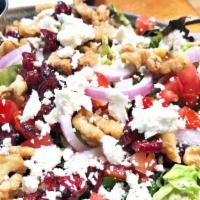 Lauren'S Goat Cheese Salad · Mixed greens with goat cheese, cranberries, walnuts, cherry tomato, and red onion