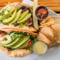 Hippie Hollow · Pita with field greens, cucumber, hummus, tomato, avocado, and jalapeno vinaigrette or ranch.