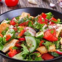 Garden Salad · Mixed greens, tomatoes, kalamata olives, red onion, and cheddar jack cheese.