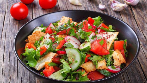Garden Salad · Mixed greens, tomatoes, kalamata olives, red onion, and cheddar jack cheese.