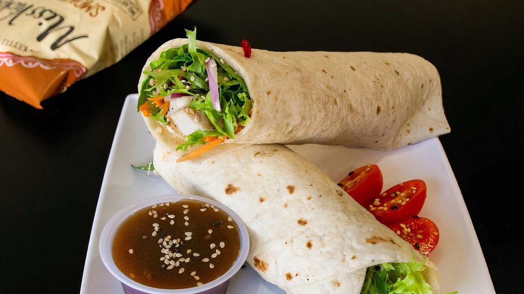 Oriental Wrap · Tomato basil wrap. Chicken breast, mixed greens, carrots, tomatoes, red onions, cucumbers, quinoa, sesame seeds, sesame ginger dressing.