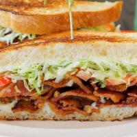 The Cubano · The lunch box's special. All natural shredded pork and nitrate-free ham served on warm bolil...
