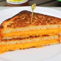 Grilled Cheddar · Butter toasted sourdough bread with Cheddar cheese.