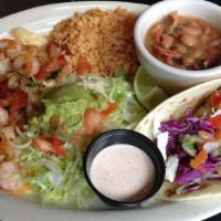 Baja Plate · Two enchiladas topped with shrimp, tomatoes, onions, garlic sour cream sauce and cheese, one...
