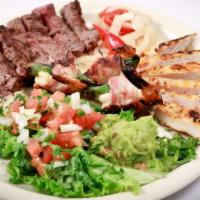 Mixed Grill · Beef, Chicken & Shrimp with Grilled Peppers & Onions, Guacamole, Sour Cream, Pico De Gallo, ...