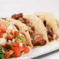 Trailer Park Tacos · Gluten free. (4) Mini brisket tacos on corn tortilla served with jack cheese, pickled red on...