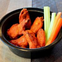 Classic Wings - Small · Tossed in your choice of sauce served with celery, carrots and a side of ranch or bleu chees...
