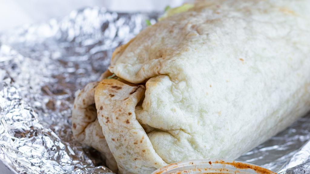 Burrito · A large flour tortilla filled with your choice of meat, rice, pinto beans, lettuce, pico de gallo, cheese, sour cream, hot, mild, and guacamole salsas.