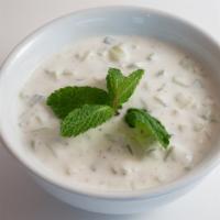 Cucumber Yogurt · A delicious mix of cucumber pieces mint garlic and yogurt.