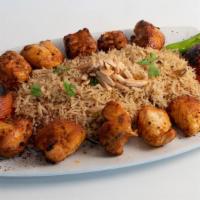 Chicken Kebob · Two skewers served over rice + Salad