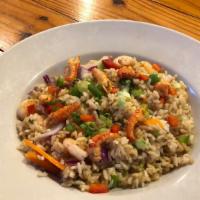 Crawfish And Shrimp Fried Rice · Crawfish and shrimp sauteed with rice, onion, green peppers, eggs, and Cajun spices.