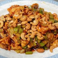 Cashew Chicken · Sliced chicken breast, mushrooms and celery sauteed in a brown sauce topped with cashew nuts.