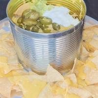 Trash Can Nachos · Piled high with ground beef, brisket Guisada and chicken, refried beans cheese, guacamole so...