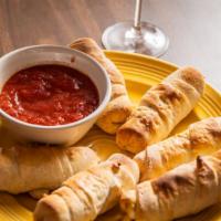 Pepperoni Rolls (6) · Pepperoni and mozzarella pizza rolls topped with garlic butter and side of marinara