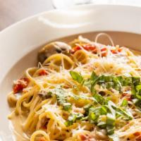 Tuscan Spaghetti · Parmesan cream sauce, sun-dried tomatoes, mushroom, garlic all topped with fresh basil
