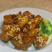 Sesame Chicken · Crunchy chicken with sesame seeds on top, in special sauce, and served with steamed broccoli.