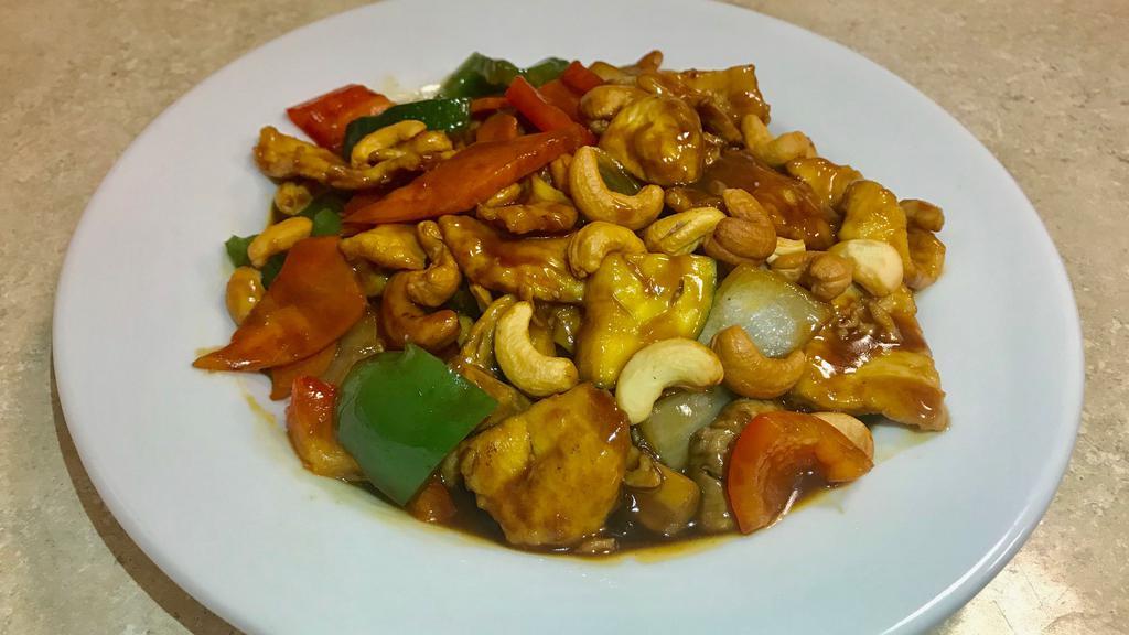 Cashew · Zucchini, carrot, mushrooms, green and red peppers, and white onions with cashew nuts in brown sauce.