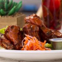 Basico Wings · Choose from buffalo garlic, soy caramel or tangy BBQ sauce.