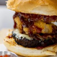 Bbq Tower (Half Pound) · Burger, swiss and munster cheese mix, bacon, onion rings and BBQ sauce.