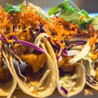 Baja Fish Tacos (4 Pc) · Beer battered swai fish tacos, served with chipotle aioli, cilantro, red cabbage, radish and...
