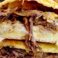 Smoked Brisket Klobasniky · Hand shredded smoked brisket, chopped onions, jalapenos, and cheese wrapped inside our sweet...