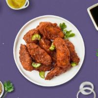 That'S Nash Hot Wings · Fresh chicken wings breaded, fried until golden brown, and tossed in Nashville Hot Sauce. Se...