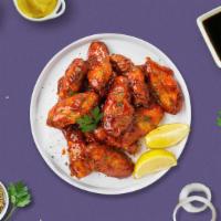 Honeyboy Bbq Wings · Fresh chicken wings breaded, fried until golden brown, and tossed in honey and barbecue sauc...