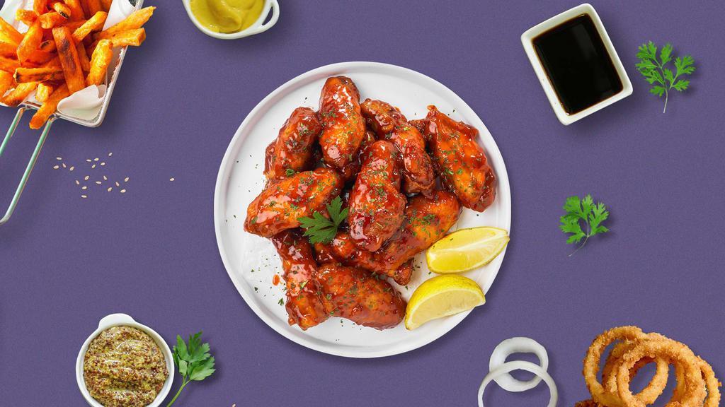Honeyboy Bbq Wings · Fresh chicken wings breaded, fried until golden brown, and tossed in honey and barbecue sauce. Served with a side of ranch or bleu cheese.