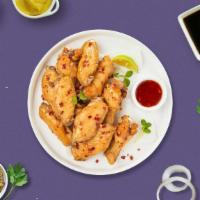 Red Hot Sweet Chili Wings · Fresh chicken wings breaded, fried until golden brown, and tossed in sweet chili sauce. Serv...