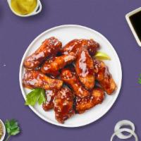 Bbq Chicken Of A Wings · Fresh chicken wings breaded, fried until golden brown, and tossed in barbecue sauce. Served ...