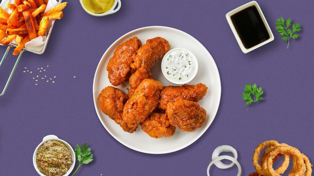 Girls Just Wanna Habanero Mango Wings · Fresh chicken wings breaded, fried until golden brown, and tossed in mango habanero sauce. Served with a side of ranch or bleu cheese.