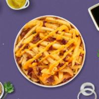 Bacon Buster Fries · Idaho potato fries cooked until golden brown and garnished with salt, melted cheddar cheese,...