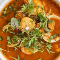 Caldo Mariscos · A nice seafood mix of shellfish, oysters, crab legs, fish, potato, and carrots slowly simmer...