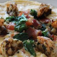 Shrimps & Grits · Cheddar and Romano cheese grits topped with shrimp, roasted tomatoes, sautéed collard greens...