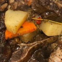 Oxtails · Slow-cooked until the meat slides right off the bones. Marinated in Jamaican seasonings ligh...