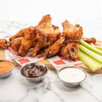 Jumbo Wings (10-Pc Regular Pack) · 10 crisp fried golden-brown wings tossed in the sauce of your choice.