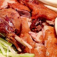Mandarin Crispy Duck · Bone in half duck served with lotus buns. 
Served with steamed or  fried rice. 
Consuming ra...