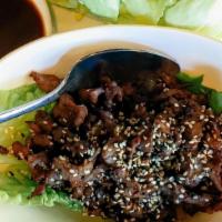 Bulgogi With Lettuce Cup · Marinated beef tenderloin with Korean BBQ sauce. 
Served with steamed or  fried rice.