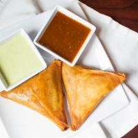 Vegetable Samosa( 2 Pieces) · Potatoes, green peas, and fresh ground spices wrapped in a homemade flour pastry dough and d...
