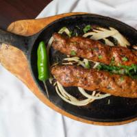 Beef Seekh Kabab · Charcoal-grilled skewers of beef marinated in fresh herbs and spices.